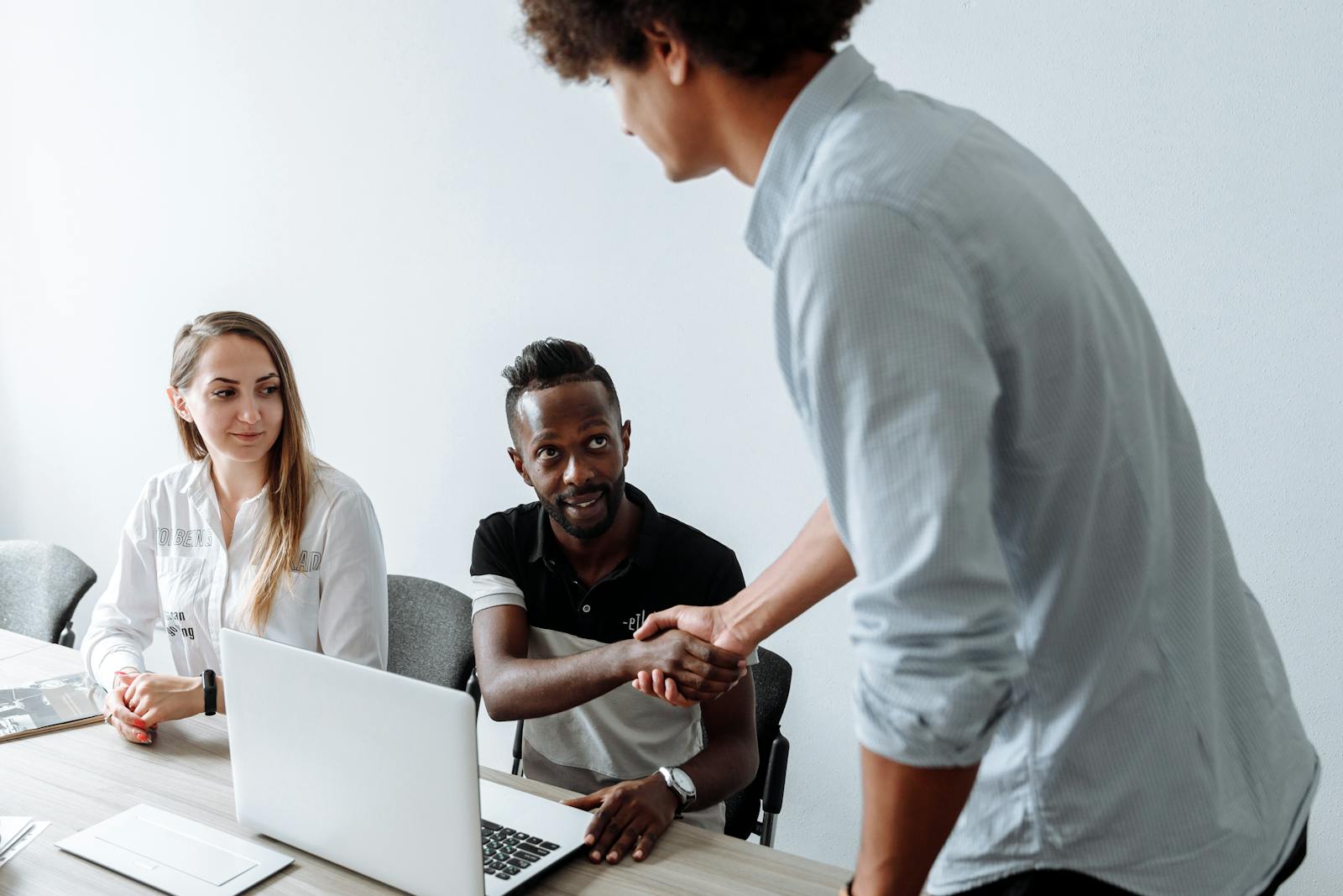 A diverse team of colleagues collaborating in an office setting.